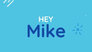Graphic created using Biteable video maker saying "hey mike" in bold dark blue letters on a light blue background with abstract white doodles.