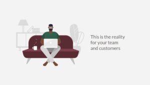 Man working on a laptop while sitting on a couch in a home setting, creating content with Biteable video maker, with the text "this is the reality for your team and customers.