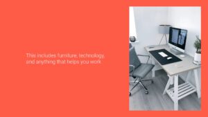 Modern office space with a white desk, office chair, and Biteable video maker setup, complemented by a plant and framed picture on a red wall.