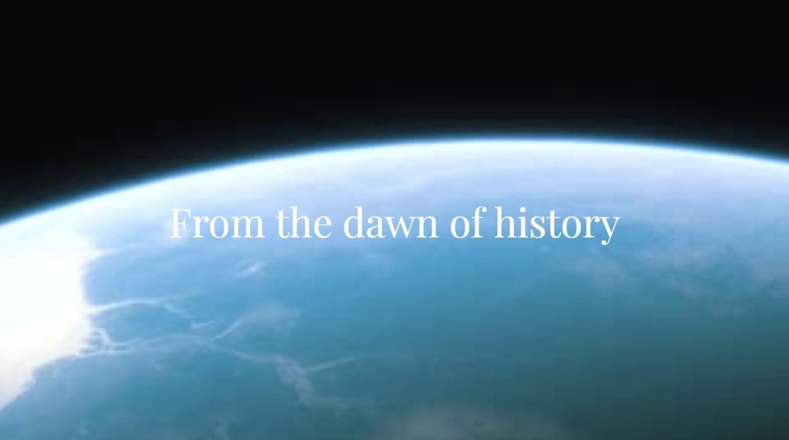 View of Earth's curved horizon from space with the text "From the dawn of history" centered across the image.