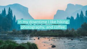 A river flows through a forested valley with mountains in the background at sunrise; overlaid text reads, "In my downtime I like hiking, photography, and coffee.